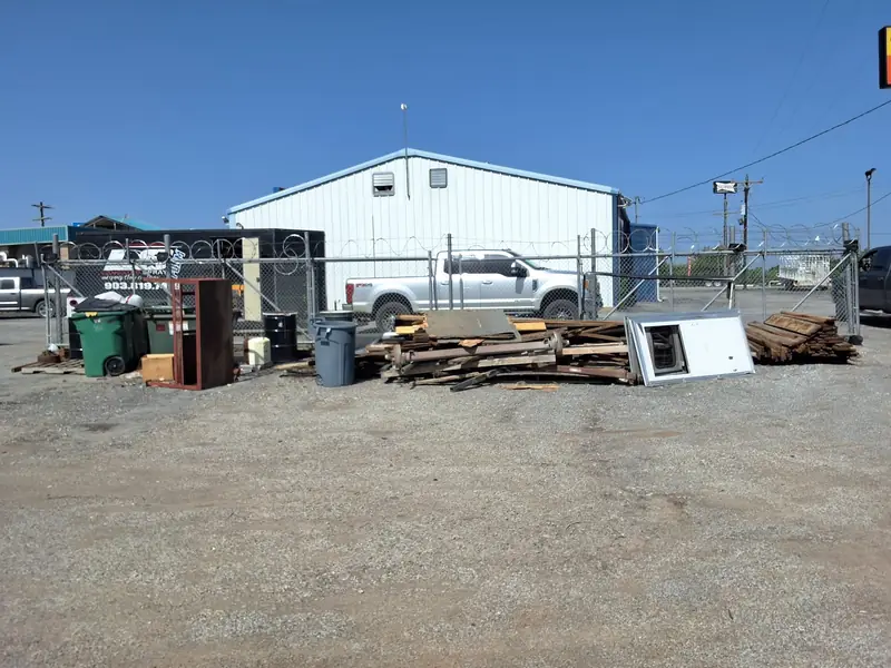 Commercial lot cleared of pallets, lumber and debris