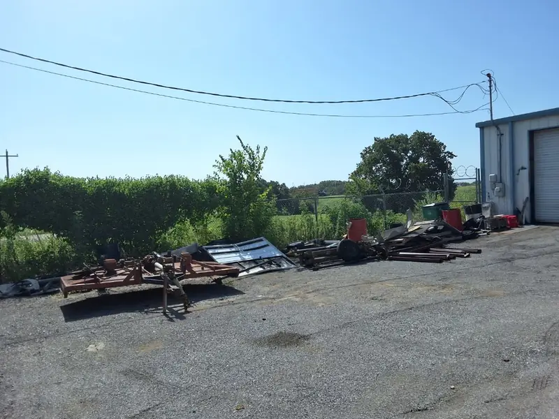 Scrap metal, trailers and equipment staged for hauling at a commercial yard